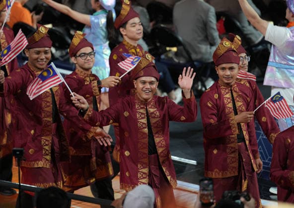 (260922) -- SHANGHAI, Sept. 22, 2026 -- Members of Malaysian delegation attend the opening ceremony of the 48th WorldSkills Competition in east China s Shanghai, Sept. 22, 2026. The 48th WorldSkills Competition opened in Shanghai on Tuesday evening, with 1,385 competitors from 68 countries and regions vying in 64 skill events. ) CHINA-SHANGHAI-WORLDSKILLS COMPETITION-OPENING CEREMONY (CN) RenxPengfei 