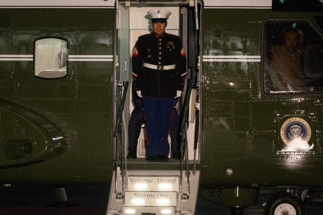 September 23, 2026, Washington, District Of Columbia, United States: A U.S. Marine opens the door of Marine One after the helicopter lands on the newly constructed White House helipad following President Donald TrumpÃ¢â‚¬â ¢s return from the United Nations General Assembly in New York City. Washington United States - ZUMAk206 20260923_znp_k206_014 Copyright: xMattxKaminskyx