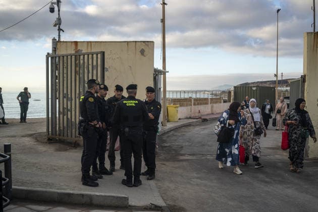 Spanish security forces reinforce Ceuta border amid mass crossing alerts CEUTA, SPAIN - SEPTEMBER 23: Members of the Spanish Civil Guard s Rapid Action Group (GRS) and National Police riot units maintain strict security vigilance along the Tarajal border crossing in the autonomous city of Ceuta, Spain on September 23, 2026. Following social media calls inciting a coordinated mass border-crossing attempt into European territory, the Spanish government deployed specialized reinforcement units from across mainland Spain to heighten border monitoring and prevent irregular entry attempts from neighboring Morocco amid the ongoing regional migration crisis. Jose Colon Anadolu Ceuta Spain. Editorial use only. Please get in touch for any other usa  Copyright: x2026xAnadoluxJosexColonx