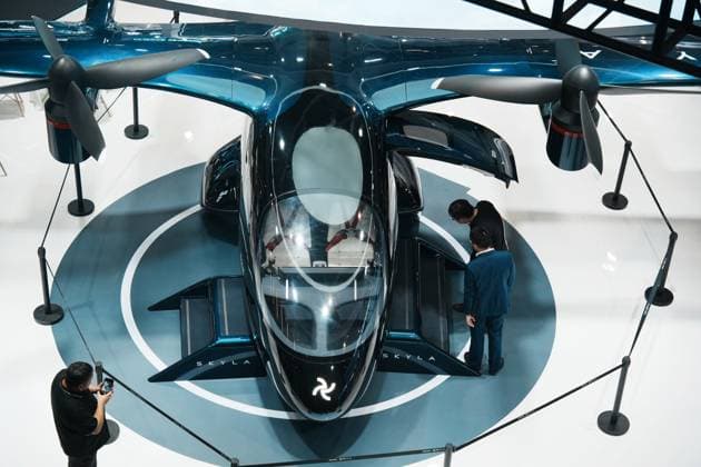 HANGZHOU, CHINA - SEPTEMBER 23: Visitors view a six-seat tilt-rotor electric vertical takeoff and landing (eVTOL) aircraft during the fifth Global Digital Trade Expo on September 23, 2026 in Hangzhou, Zhejiang Province of China. The expo focuses on frontier technologies including artificial intelligence.  Copyright: xVCGx 111669002998