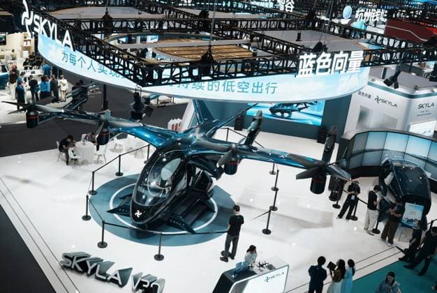 HANGZHOU, CHINA - SEPTEMBER 23: Visitors view a six-seat tilt-rotor electric vertical takeoff and landing (eVTOL) aircraft at the fifth Global Digital Trade Expo on September 23, 2026 in Hangzhou, Zhejiang Province of China. The expo focuses on frontier technologies including artificial intelligence.  Copyright: xVCGx 111669003010