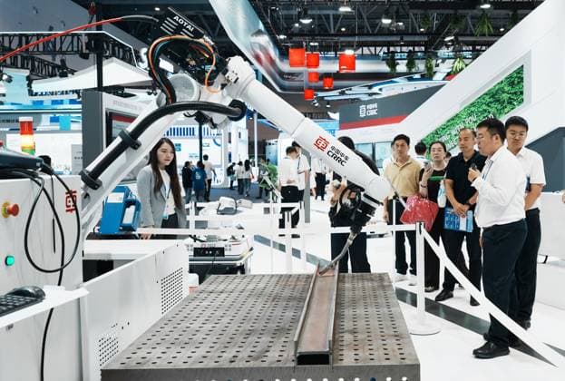 HANGZHOU, CHINA - SEPTEMBER 23: Visitors view a rail inspection robot developed by CRRC that detects high-speed railway tracks during the fifth Global Digital Trade Expo on September 23, 2026 in Hangzhou, Zhejiang Province of China. The expo focuses on frontier AI technologies and digital trade.  Copyright: xVCGx 111669003013