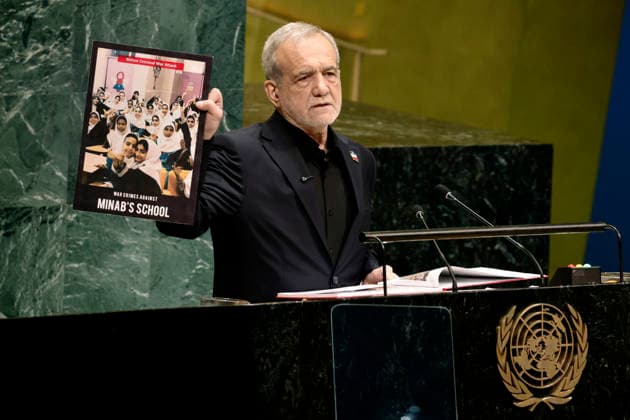 President of Islamic Republic of Iran Masoud Pezeshkian.holds picture of the school children killed during a US airstrike in Iran as he speaks at the UN General Assembly 81st session General Debate in UN General Assembly Hall at the United Nations Headquarters on Wednesday, September 23, 2026 in New York City.  NYP20260923409 PETERxFOLEY