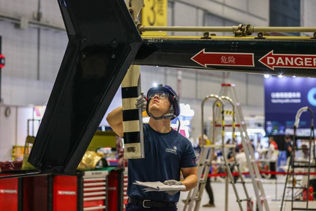 SHANGHAI, CHINA - SEPTEMBER 23: A competitor takes part in the aircraft maintenance event during the opening of the 48th World Skills Competition on September 23, 2026 in Shanghai, China. The global vocational skills tournament brings together participants from around the world to demonstrate their technical abilities.  Copyright: xVCGx 111669072203