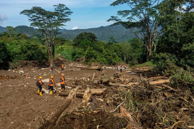 September 23, 2026, Solok Regency, Indonesia: SOLOK, WEST SUMATRA, INDONESIA, SEPTEMBER 23, 2026: Members of a joint search and rescue team comb an area affected by flash flooding in Arosuka, Solok, West Sumatra, as operations continue to locate a missing resident. Search teams from Indonesiaâ€⠢s National Search and Rescue Agency (BASARNAS), working alongside local residents, are searching for 59-year-old Agusral, who was reported missing after being swept away by floodwaters on September 21. Search efforts focused on several locations along the path of flood debris and a nearby river. Solok Regency Indonesia - ZUMAq101 20260923_zna_q101_021 Copyright: xWawanxKurniawanx