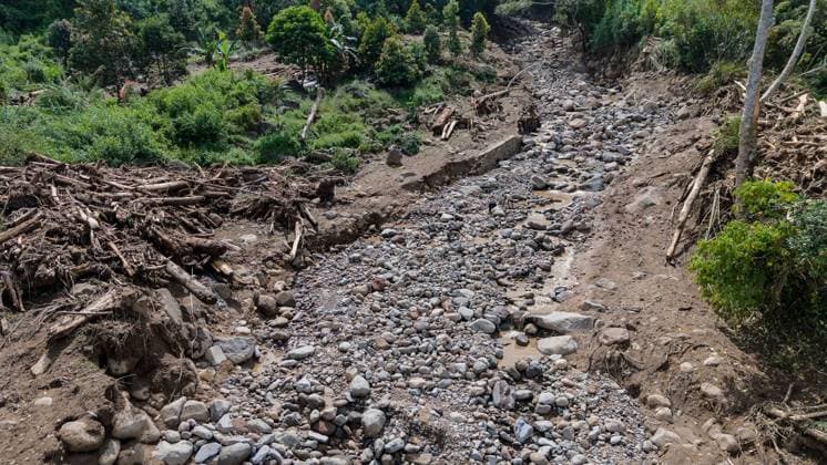 September 23, 2026, Solok Regency, Indonesia: SOLOK, WEST SUMATRA, INDONESIA, SEPTEMBER 23, 2026: Members of a joint search and rescue team comb an area affected by flash flooding in Arosuka, Solok, West Sumatra, as operations continue to locate a missing resident. Search teams from Indonesiaâ€⠢s National Search and Rescue Agency (BASARNAS), working alongside local residents, are searching for 59-year-old Agusral, who was reported missing after being swept away by floodwaters on September 21. Search efforts focused on several locations along the path of flood debris and a nearby river. Solok Regency Indonesia - ZUMAq101 20260923_zna_q101_028 Copyright: xWawanxKurniawanx
