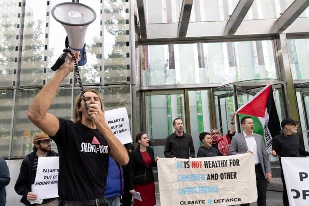 September 23, 2026, New York, New York, USA: ACT UP NY leads a coalition of organizations blockading the entrance to 1 WTC and later blocking traffic on the West Side Highway demonstrating under the banner AI OUT OF OUR HEALTHCARE! PALANTIR OUT OF MOUNT SINAI! as the Newsweek AI Health Summit is held inside the building and a keynote speaker is Dr. Brendan Carr, (not pictured) CEO of Mount Sinai. Approximately 20 protesters are arrested by NYPD. Part of the MONEY FOR AIDS and HEALTHCARE! NOT FOR ICE and WARFARE! ACT UP (AIDS Coalition To Unleash Power) campaign, demonstrators denounce Mount Sinai s contract with Palantir, a surveillance, data analytics and military tech company. Protesters chant and hold banners and signs that read AI IS  - ZUMAr174 20260923_znp_r174_002 Copyright: xGinaxMxRandazzox