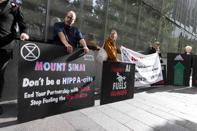 September 23, 2026, New York, New York, USA: ACT UP NY leads a coalition of organizations blockading the entrance to 1 WTC and later blocking traffic on the West Side Highway demonstrating under the banner AI OUT OF OUR HEALTHCARE! PALANTIR OUT OF MOUNT SINAI! as the Newsweek AI Health Summit is held inside the building and a keynote speaker is Dr. Brendan Carr, (not pictured) CEO of Mount Sinai. Approximately 20 protesters are arrested by NYPD. Part of the MONEY FOR AIDS and HEALTHCARE! NOT FOR ICE and WARFARE! ACT UP (AIDS Coalition To Unleash Power) campaign, demonstrators denounce Mount Sinai s contract with Palantir, a surveillance, data analytics and military tech company. Protesters hold banners that read MOUNT SINAI Don t be a HI  - ZUMAr174 20260923_znp_r174_024 Copyright: xGinaxMxRandazzox