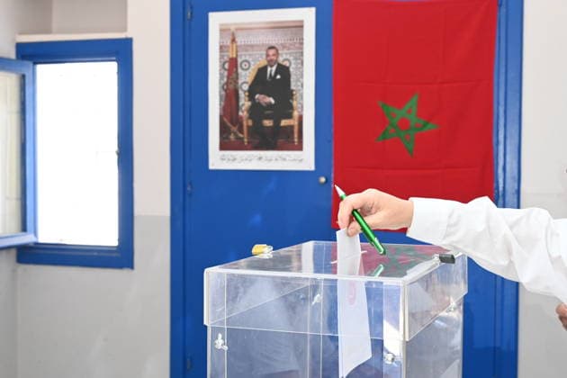 (260923) -- RABAT, Sept. 23, 2026 -- A voter casts a ballot at a polling station in Rabat, Morocco, Sept. 23, 2026. Polling stations opened on Wednesday morning across Morocco for legislative elections to renew the 395 members of the House of Representatives, parliament s lower house. (Photo by Xinhua) MOROCCO-RABAT-LEGISLATIVE ELECTIONS-VOTE Aissa 