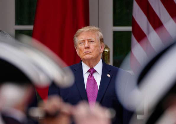 President Donald Trump watches a fife and drum corps perform during an arrival ceremony for Chinese President Xi Jinping at the White House in Washington DC on Thursday, September 24, 2026. Xi is on a three-day state visit to the U.S. and will hold talks with U.S. officials on tariffs, AI, and other issues.  WAP20260924728 BONNIExCASH