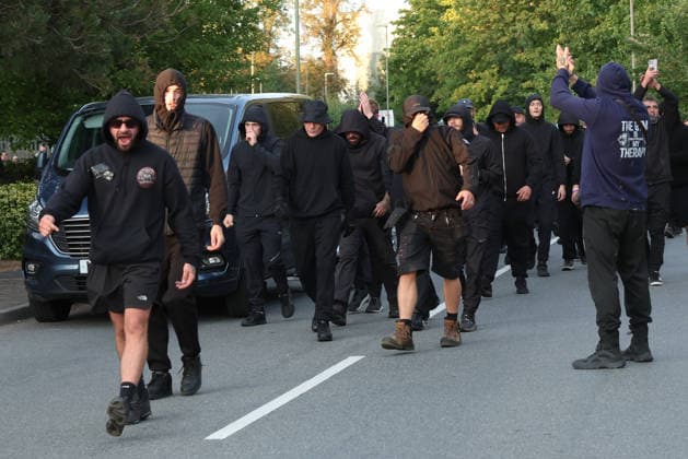 September 24, 2026, Basingstoke, Hampshire, UK: Basingstoke, UK. Members of The Patriot Platform and supporters Protest outside a police station where Daniel Thomas, also know as Danny Tommo, is being held, in Basingstoke, Hampshire. Anti-migrant protester Daniel Thomas has been arrested on suspicion of criminal damage with intent to endanger life after an incident in the English Channel. Basingstoke UK  - ZUMAl94_ 20260924_zaf_l94_029 Copyright: xJacquelinexLawriex