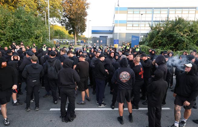 September 24, 2026, Basingstoke, Hampshire, UK: Basingstoke, UK. Members of The Patriot Platform and supporters Protest outside a police station where Daniel Thomas, also know as Danny Tommo, is being held, in Basingstoke, Hampshire. Anti-migrant protester Daniel Thomas has been arrested on suspicion of criminal damage with intent to endanger life after an incident in the English Channel. Basingstoke UK  - ZUMAl94_ 20260924_zaf_l94_036 Copyright: xJacquelinexLawriex