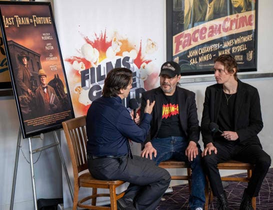 September 24, 2026, Dallas, Texas, U.S.A: From L-R PR JOHN WILDMAN of Wildworks PR in Dallas interviewing Director ADAM RIFKIN and JASON PAXTON (Son of the Late BILL PAXTON) in his starring roll as an Illiterate outlaw named JEDIDIAH DOOLEY Dallas U.S.A  - ZUMAm147 20260924_zap_m147_009 Copyright: xHossxMcBainx
