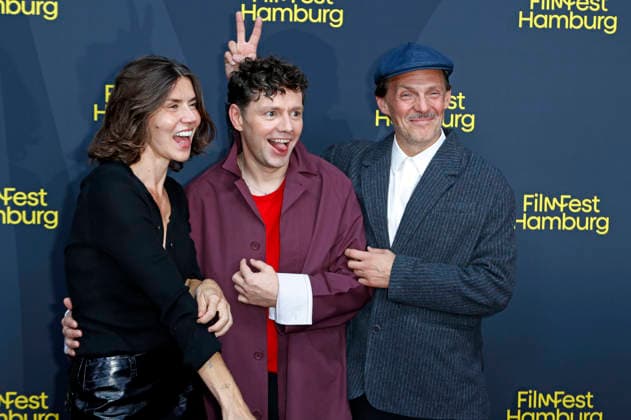 Malgorzata Szumowska, Christian Friedel und Michal Englert bei der Festivaleröffnung mit der Premiere des Kinofilms The Idiot(s) auf dem 34. Filmfest Hamburg 2026 im Cinemaxx Dammtor. Hamburg, 24.09.2026