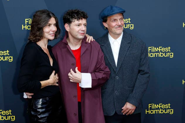 Malgorzata Szumowska, Christian Friedel und Michal Englert bei der Festivaleröffnung mit der Premiere des Kinofilms The Idiot(s) auf dem 34. Filmfest Hamburg 2026 im Cinemaxx Dammtor. Hamburg, 24.09.2026