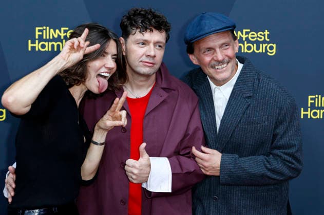 Malgorzata Szumowska, Christian Friedel und Michal Englert bei der Festivaleröffnung mit der Premiere des Kinofilms The Idiot(s) auf dem 34. Filmfest Hamburg 2026 im Cinemaxx Dammtor. Hamburg, 24.09.2026