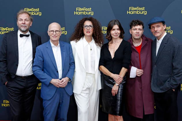 Helge Albers, Peter Tschentscher, Malika Rabahallah, Malgorzata Szumowska, Christian Friedel und Michal Englert bei der Festivaleröffnung mit der Premiere des Kinofilms The Idiot(s) auf dem 34. Filmfest Hamburg 2026 im Cinemaxx Dammtor. Hamburg, 24.09.2026