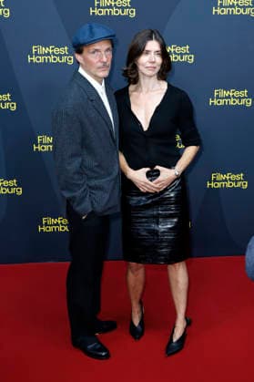 Michal Englert und Malgorzata Szumowska bei der Festivaleröffnung mit der Premiere des Kinofilms The Idiot(s) auf dem 34. Filmfest Hamburg 2026 im Cinemaxx Dammtor. Hamburg, 24.09.2026