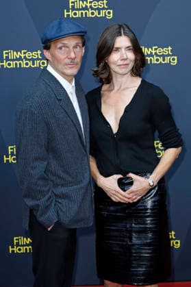 Michal Englert und Malgorzata Szumowska bei der Festivaleröffnung mit der Premiere des Kinofilms The Idiot(s) auf dem 34. Filmfest Hamburg 2026 im Cinemaxx Dammtor. Hamburg, 24.09.2026