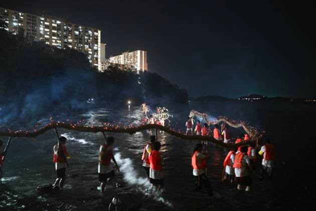RECORD DATE NOT STATED Hong Kong Pok Fu Lam Village Fire Dragon 2026 Performers putting a Fire Dragon into the sea during a fire dragon dance performance in Wah Fu Estate at Mid-autumn Festival on September 25, 2026 in Hong Kong. (Photo by Kobe Li Nexpher Images) Hong Kong