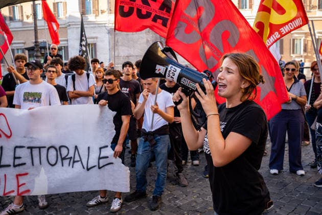 September 25, 2026, Rome, Rm, Italy: Students are taking to the streets to march on Montecitorio - Chamber of Deputies - to protest the new school decree-law issued yesterday by the Meloni government, arguing that the real issues facing schools lie elsewhere. Students call it the Racism Decree because it establishes, among other things, a cap on the number of foreign students per class and bans the wearing of the niqab and burqa during lessons. No to the Racism Decree. Less election campaigning, more funding for schools reads the banner. Rome Italy - ZUMAg256 20260925_znp_g256_005 Copyright: xMarcoxDixGianvitox