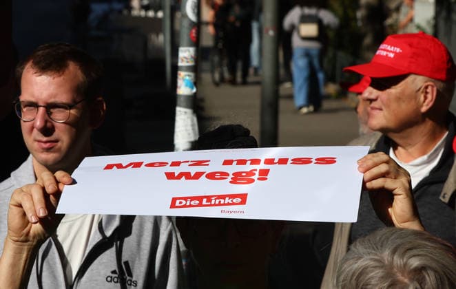 Politics, Demonstration against the labor reform in Germany a protester holds a banner against the germany Chancellor Merz during the Demonstration against the labor reform in Nuremberg , Bayern , Germany . September 26th, 2026 Photo by Davide Elias Copyright: xDavidexEliasx