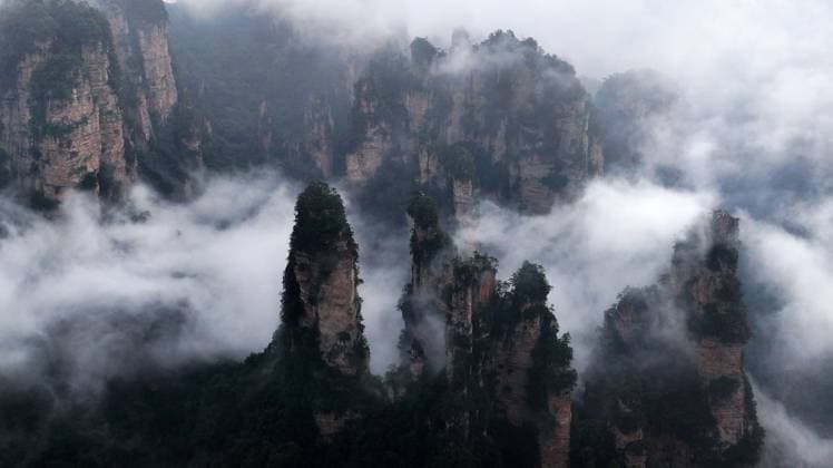 ZHANGJIAJIE, CHINA - SEPTEMBER 26: Tourists visit Zhangjiajie National Forest Park to enjoy the natural scenery during the Mid-Autumn Festival holiday on September 26, 2026 in Zhangjiajie, Hunan Province of China. The park attracted numerous domestic and international visitors for vacation and leisure activities.  Copyright: xVCGx 111669753025