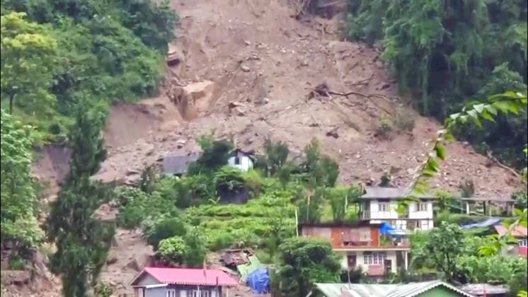 RECORD DATE NOT STATED Massive Landslide Damages Over 32 Houses in Sikkim™s Rimbi After Heavy Rainfall Sikkim, Sep 26 (ANI): A view of the massive landslide scar on the hillside after incessant heavy rainfall triggered a major landslide in Rimbi village under the Yuksom-Tashiding constituency, damaging over 32 houses and government quarters on Saturday. (ANI Video Grab) Sikkim India Copyright: xANIx ANI_20260926156