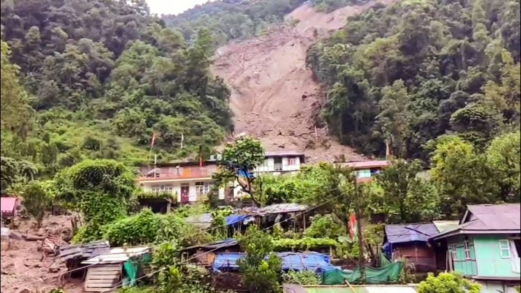 RECORD DATE NOT STATED Massive Landslide Damages Over 32 Houses in Sikkim™s Rimbi After Heavy Rainfall Sikkim, Sep 26 (ANI): A view of the massive landslide scar on the hillside after incessant heavy rainfall triggered a major landslide in Rimbi village under the Yuksom-Tashiding constituency, damaging over 32 houses and government quarters on Saturday. (ANI Video Grab) Sikkim India Copyright: xANIx ANI_20260926157