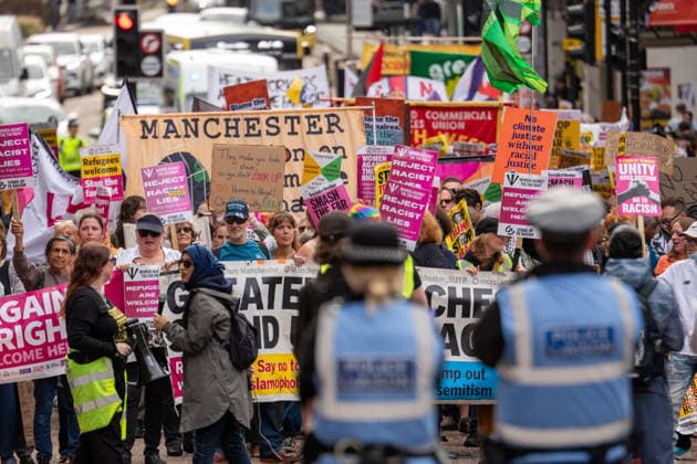 September 26, 2026, Manchester, United Kingdom: Protesters hold banners and placards during the demonstration. Activists in Manchester march for Stand Up To Racism against the far right. In addition to anti-racist slogans promoting diversity and migrant rights, demonstrators carried banners of the RNLI (Royal National Lifeboat Institution) following recent Patriot Platform protests. The broad coalition of trade unions, community groups, and political organisations featured prominent banners from BECTU (Broadcasting, Entertainment, Communications and Theatre Union) and Jewish Voice for Labour (JVL). Manchester, United Kingdom. Manchester United Kingdom  - ZUMAs197 20260926_aaa_s197_220 Copyright: xGaryxRobertsx