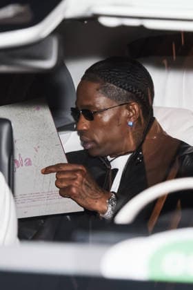 IPA89011565 - Milan, Celebrity Sightings During Milan Fashion Week Women s Collection Spring Summer 2027 - Women s Fashion, Spring Summer 2027. Pictured: Travis Scott (American rapper) leaving the Armani Hotel on his way to the Bottega Veneta fashion show  Copyright: xAlessandroxBremecx xx IPA89011565