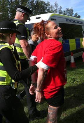 September 26, 2026, Huntingdon, United Kingdom: An activist is arrested after interfering with staff members as they left the factory during the protest. Save The Dogs UK march to end animal testing culminating in a rally at MBR Acres in Huntingdon. The facility produces beagle puppies for the vivisection industry. The march to MBR Acres was held at the same time as a two-week march by animal activists in the USA arrived at Marshall BioResources in New York. Both sets of activists claim ™Two Countries, Two Marches. One Shared Message™ The protesters insist both Marshall BioResourses and MBR Acres are closed and demand a future beyond animal testing. Huntingdon United Kingdom - ZUMAs197 20260926_aaa_s197_443 Copyright: xMartinxPopex