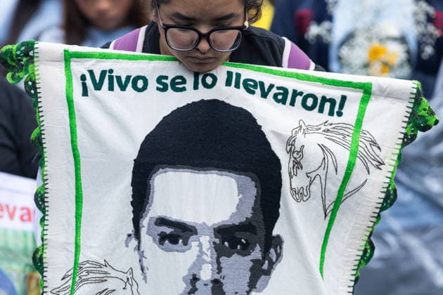 September 26, 2026, Mexico City, Mexico: Families of the 43 students from the Raul Isidro Burgos Rural Teachers College of Ayotzinapa, students and social organizations took part in a march from the Angel of Independence to the Zocalo in Mexico City, marking 12 years since the students disappeared in Iguala, Guerrero. Demonstrators demanded truth and justice. Mexico City Mexico - ZUMAl178 20260926_znp_l178_018 Copyright: xCristianxLeyvax
