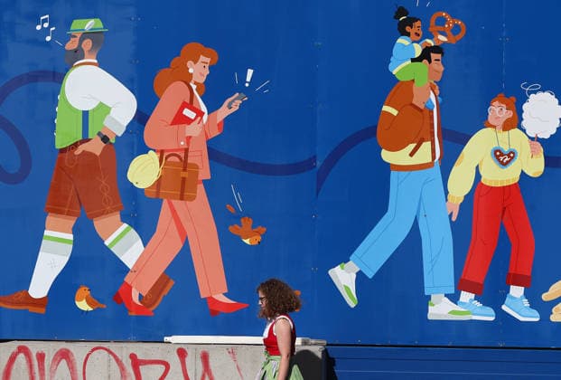 Germany world s largest beer festival Oktoberfest A girl in traditional Bavarian clothing walks past a mural depicting figures during the world s largest beer festival Oktoberfest in Munich, Germany, September 27th , 2026 . Photo by Davide Elias Copyright: xDavidexEliasx