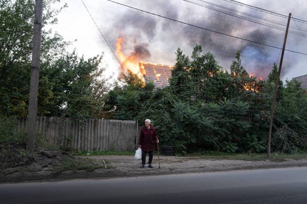 September 27, 2026, Sloviansk, Donetsk Oblast, Ukraine: A local Resident walks past a Russian drone attack on a residential area in the frontline city of Sloviansk, Donetsk Oblast, Ukraine, September 28, 2026. Sloviansk Ukraine - ZUMAm350 20260927_zip_m350_006 Copyright: xCameronxJones-Manleyx