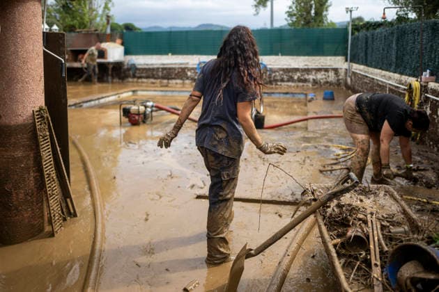 Heavy rains in Catalonia leave two dead and the Besòs River at risk of flooding. Residents clean up the mud that has accumulated in the streets and homes due to the torrential rains, on October 4, 2026, in Montornès del Vallès, Barcelona, Catalonia, Spain. The storm hitting Catalonia has left two people dead in the region. The president of the Generalitat, Salvador Illa, reported the death in Tordera of a 75-year-old man, who was at a campground when a wall reportedly collapsed on him. The second victim is a person who had been reported missing and was found in Montornès del Vallès. Emergency services are searching for another missing person in Riera de Pineda de Mar. The rains and storms have put eleven autonomous communities on alert thi Copyright: xLorenaxSopênax 7820139