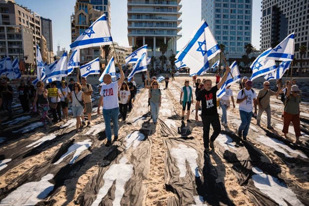 October 7, 2026, Tel Aviv, Tel Aviv, Israel: Activists carry flags at the beach in protest against the Israeli government on the third anniversary of October 7th. Tel Aviv Israel - ZUMAg280 20261007_znp_g280_007 Copyright: xYoavxGinsburgx