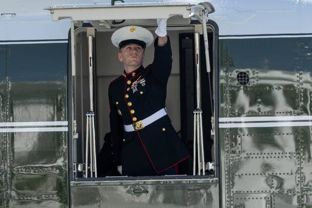 October 7, 2026, Washington, District Of Columbia, United States: A U.S. Marine shuts the door of Marine One on the South Lawn of the White House ahead of President DONALD TRUMPÃ¢â‚¬â ¢s departure for San Antonio, Texas, where he is scheduled to headline a midterm campaign rally. Washington United States - ZUMAk206 20261007_znp_k206_007 Copyright: xMattxKaminskyx