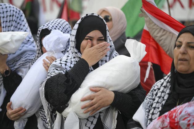 Police in Berlin intervened in demonstrations in support of Palestinians BERLIN, GERMANY - OCTOBER 7: Demonstrators hold toy dolls wrapped in white shrouds to symbolize Palestinian children killed in Israeli attacks, during a pro-Palestine rally organized by Palestinian associations at the intersection of Zimmer and Friedrich streets in Berlin, Germany on October 7, 2026. Halil Sagirkaya Anadolu Berlin Germany. Editorial use only. Please get in touch for any other usage.  Copyright: x2026xAnadoluxHalilxSagirkayax
