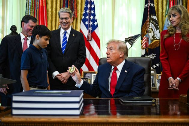 WASHINGTON, DC - OCT. 7: United States President Donald J Trump hands a challenge coin to a child during an announcement on Trump Accounts in the Oval Office of the White House in Washington, DC, USA, on Wednesday, October 7, 2026. Standing behind the President, from left to right: Frank J Bisignano, Commissioner, Social Security Administration (SSA); US Secretary of the Treasury Scott Bessent; and Susan Dell, wife of Dell Technologies CEO Michael Dell. Copyright: xAnnabellexGordon PoolxviaxCNPx MediaPunchx