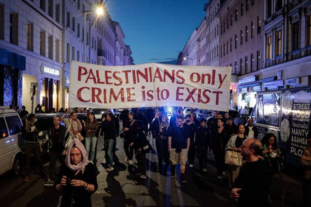 Third anniversary of the Hamas-led October 7, 2023 attack on Israel in Berlin, Germany -7 OCT 2026. A large group of pro-Palestinian protesters seen marching from Oranienplatz while holding a large banner reading Palestinians’ only crime is to exist during a demonstration marking the third anniversary of the Hamas-led October 7, 2023 attack on Israel. Berlin’s assembly authority listed the march under the slogan Down with Colonialism! It was registered to begin at 6 p.m. at Oranienplatz in the Kreuzberg district and proceed via Oranienstrasse, Skalitzer Strasse and Kottbusser Tor toward Hermannplatz. The demonstration was one of several events announced in Berlin for the third anniversary of the October 7, 2023 attack on Israel. The o Copyright: xVasilyxKrestyaninovx xSOPAxImagesx _VKR5596