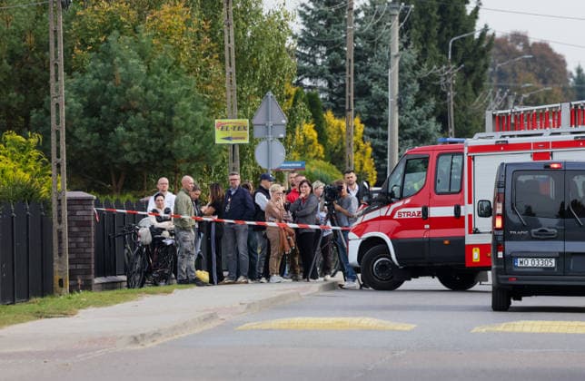Stabbing attack at a primary school in Poland Photo: Wojciech Olkusnik East News People gather outside after a knife attack at the local primary school on October 8, 2026 in the village of Leszczydol-Nowiny in central Poland, approximately 60 km north-east of Warsaw. A 15-year-old school graduate entered the building armed with a knife and fatally stabbed the janitor and wounded two teachers trying to overpower him. According to the police the perpetrator was wearing a helmet with a camera and planned to record the attack. A day earlier a stabbing attack, where nine people were wounded, occurred in a vocational school in the town of Ostroleka, 50 km north of today s site. EN_01685559_0011 