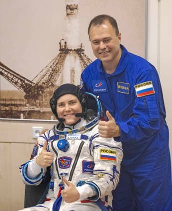 October 8, 2026, Baikonur, Kazakhstan: Baikonur, Kazakhstan. 14 July, 2026. Roscosmos cosmonaut Anna Kikina and backup crew member Dmitry Petelin give a thumbs up before her Sokol suit pressure check at the Baikonur Cosmodrome, July 14, 2026 in Baikonur, Kazakhstan. She launched to the International Space Station later that day. Baikonur Kazakhstan - ZUMAp138 20261008_zaa_p138_046 Copyright: xBillxIngalls Nasax