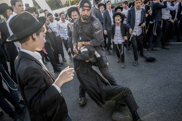 Anti-military service Ultra-Orthodox Jews block road to West Jerusalem JERUSALEM - OCTOBER 8: Israeli police deployed to the scene intervene against the demonstrators as Ultra-Orthodox Jews, known as Haredi, protest the lack of legislation exempting yeshiva students from mandatory military service and the detention of students on grounds of draft evasion in West Jerusalem, on October 8, 2026. Haredi protesters lie on the road leading to West Jerusalem and block traffic. Mostafa Alkharouf Anadolu Jerusalem Israel. Editorial use only. Please get in touch for any other usage.  Copyright: x2026xAnadoluxMostafaxAlkharoufx