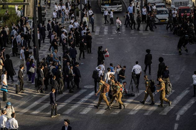 Anti-military service Ultra-Orthodox Jews block road to West Jerusalem JERUSALEM - OCTOBER 8: Ultra-Orthodox Jews, known as Haredi, protest the lack of legislation exempting yeshiva students from mandatory military service and the detention of students on grounds of draft evasion in West Jerusalem, on October 8, 2026. Haredi protesters lie on the road leading to West Jerusalem and block traffic, while Israeli police deployed to the scene intervene against the demonstrators. Mostafa Alkharouf Anadolu Jerusalem Israel. Editorial use only. Please get in touch for any other usage.  Copyright: x2026xAnadoluxMostafaxAlkharoufx