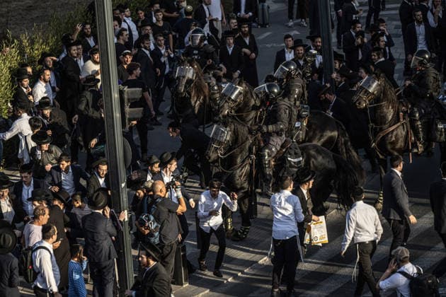 Anti-military service Ultra-Orthodox Jews block road to West Jerusalem JERUSALEM - OCTOBER 8: Mounted Israeli police officers on horseback deployed to the scene intervene against demonstrators as Ultra-Orthodox Jews, known as Haredi, protest the lack of legislation exempting yeshiva students from mandatory military service and the detention of students on grounds of draft evasion in West Jerusalem, Israel, on October 8, 2026. Haredi protesters lie on the road leading to West Jerusalem and block traffic. Mostafa Alkharouf Anadolu Jerusalem Israel. Editorial use only. Please get in touch for any other usage.  Copyright: x2026xAnadoluxMostafaxAlkharoufx