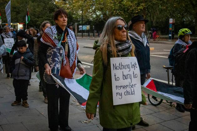 Pro-Palestine Silent Funeral Procession Central London, October 8, 2026 A pro-Palestine silent funeral procession took place in Central London, with demonstrators walking in silence to remember Palestinians killed in the conflict in Gaza. Participants carried Palestinian flags and placards, while some held a coffin and others carried effigies wrapped in burial shrouds, symbolising those killed in the conflict., Credit:Zak Irfan Avalon  Copyright: xZakxIrfanx xAvalonx 1141548418
