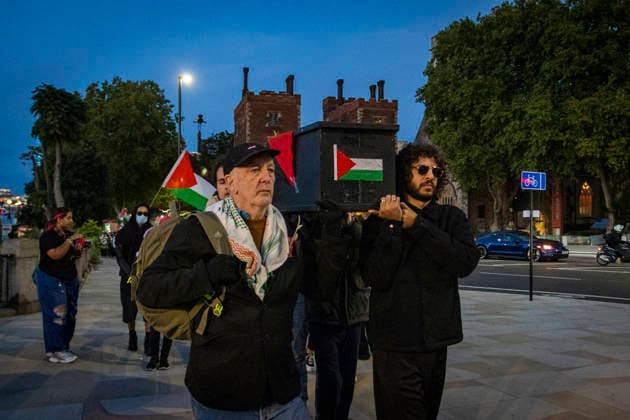 Pro-Palestine Silent Funeral Procession Central London, October 8, 2026 A pro-Palestine silent funeral procession took place in Central London, with demonstrators walking in silence to remember Palestinians killed in the conflict in Gaza. Participants carried Palestinian flags and placards, while some held a coffin and others carried effigies wrapped in burial shrouds, symbolising those killed in the conflict., Credit:Zak Irfan Avalon  Copyright: xZakxIrfanx xAvalonx 1141551868