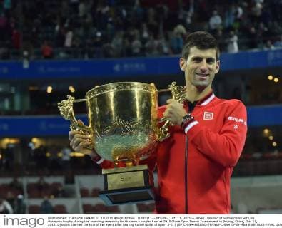 (151011) -- BEIJING, Oct. 11, 2015 -- Novak Djokovic of Serbia poses with his champion trophy during the awarding ceremony for the men s singles final at 2015 China Open Tennis Tournament in Beijing, China, Oct. 11, 2015. Djokovic claimed the title of the event after beating Rafael Nadal of Spain 2-0. ) (SP)CHINA-BEIJING-TENNIS-CHINA OPEN-MEN S SINGLES-FINAL LixWen