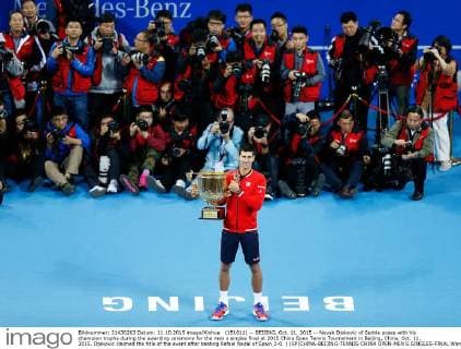 (151011) -- BEIJING, Oct. 11, 2015 -- Novak Djokovic of Serbia poses with his champion trophy during the awarding ceremony for the men s singles final at 2015 China Open Tennis Tournament in Beijing, China, Oct. 11, 2015. Djokovic claimed the title of the event after beating Rafael Nadal of Spain 2-0. ) (SP)CHINA-BEIJING-TENNIS-CHINA OPEN-MEN S SINGLES-FINAL WangxLili